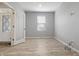 Bright and airy bedroom with neutral walls, hardwood floors, and a large window at 6672 Eagles Nest Ln, McCordsville, IN 46055