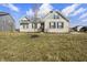 Inviting single-story brick home featuring a manicured lawn and classic architectural details at 6672 Eagles Nest Ln, McCordsville, IN 46055