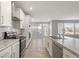 Well-equipped kitchen with stainless steel appliances, granite countertops, and an open layout at 6672 Eagles Nest Ln, McCordsville, IN 46055