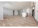 Expansive living space showcasing hardwood floors and seamless transitions to other areas of the home at 6672 Eagles Nest Ln, McCordsville, IN 46055