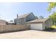 Large fenced backyard features a detached garage and plenty of space for outdoor activities at 7372 Deerfield Dr, Greenfield, IN 46140
