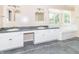 Bright bathroom boasts double sinks, white cabinets, and tub, with great natural light at 7372 Deerfield Dr, Greenfield, IN 46140