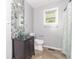 Unique bathroom with glass vessel sink, mosaic wall tiles, and modern fixtures at 7372 Deerfield Dr, Greenfield, IN 46140