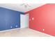 Colorful bedroom featuring a closet and open doorway with neutral carpet at 7372 Deerfield Dr, Greenfield, IN 46140