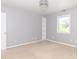 Airy bedroom with a statement light fixture and large window for natural light at 7372 Deerfield Dr, Greenfield, IN 46140