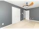 A spacious bedroom featuring a ceiling fan and a large closet for ample storage at 7372 Deerfield Dr, Greenfield, IN 46140