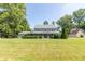 Beautifully landscaped front yard leads to a classic two-story home with inviting curb appeal at 7372 Deerfield Dr, Greenfield, IN 46140