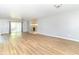 Bright, open-concept living room featuring hardwood floors, natural light, and a modern fireplace at 7372 Deerfield Dr, Greenfield, IN 46140