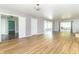 Open living area features hardwood floors, neutral walls, and sliding glass doors leading to outdoor space at 7372 Deerfield Dr, Greenfield, IN 46140