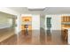 Bright interior featuring hardwood floors, a built-in office nook with storage, and an open floor plan at 7372 Deerfield Dr, Greenfield, IN 46140