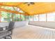 Cozy screened-in porch with wood flooring and ceiling, perfect for relaxing at 7372 Deerfield Dr, Greenfield, IN 46140