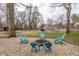 Cozy backyard fire pit area surrounded by Adirondack chairs for outdoor gatherings at 7806 Meadowbrook Dr, Indianapolis, IN 46240