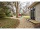 Backyard with a fire pit area and path leading to the back of the house at 7806 Meadowbrook Dr, Indianapolis, IN 46240