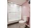 Clean bathroom featuring a toilet and a glass-enclosed shower with tiled flooring at 7806 Meadowbrook Dr, Indianapolis, IN 46240