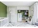 Stylish Bedroom with light green walls, built-in storage, and a cozy reading corner at 7806 Meadowbrook Dr, Indianapolis, IN 46240