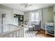 Charming Bedroom with ample storage, closet, and a light green wall at 7806 Meadowbrook Dr, Indianapolis, IN 46240