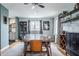 Open dining room featuring hardwood floors, stylish furniture, and a view into the kitchen at 7806 Meadowbrook Dr, Indianapolis, IN 46240
