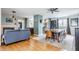 Open concept dining room and living room featuring wood floors and lots of natural light at 7806 Meadowbrook Dr, Indianapolis, IN 46240