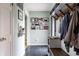 Stylish entryway featuring slate floors, coat rack, and gallery wall at 7806 Meadowbrook Dr, Indianapolis, IN 46240