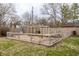 Fenced garden plot with wooden frame structure ready for planting at 7806 Meadowbrook Dr, Indianapolis, IN 46240