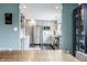 Modern kitchen design with stainless steel appliances, light gray cabinets, and sleek black tile floors at 7806 Meadowbrook Dr, Indianapolis, IN 46240