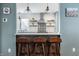 Modern kitchen featuring white subway tiles, floating shelves, and stylish decor at 7806 Meadowbrook Dr, Indianapolis, IN 46240