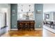 Open view into kitchen with marble countertops and wood stools at 7806 Meadowbrook Dr, Indianapolis, IN 46240