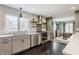 Modern kitchen featuring white subway tiles, gray cabinets and stainless steel appliances at 7806 Meadowbrook Dr, Indianapolis, IN 46240