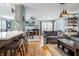 Open-concept living space with hardwood floors and modern furnishings at 7806 Meadowbrook Dr, Indianapolis, IN 46240