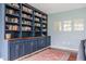 Comfortable living room with custom built-in bookshelves and elegant design at 7806 Meadowbrook Dr, Indianapolis, IN 46240