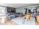 Spacious living room with large sectional sofa, coffee table, built-in shelving, and bright natural light at 7806 Meadowbrook Dr, Indianapolis, IN 46240