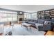 Cozy living room with a brick fireplace, built-in bookshelves, and a comfortable sectional sofa at 7806 Meadowbrook Dr, Indianapolis, IN 46240