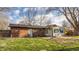 The backyard of the home features a patio, sunroom, and brick facade at 7939 Sharon Dr, Avon, IN 46123