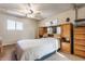 This bedroom features a ceiling fan, a double bed, and an array of storage at 7939 Sharon Dr, Avon, IN 46123