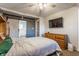 This bedroom features a ceiling fan, a double bed, and a closet with a sliding door at 7939 Sharon Dr, Avon, IN 46123