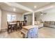 Open-concept dining area with modern flooring and a window for natural light at 7939 Sharon Dr, Avon, IN 46123