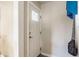 Clean, neutral entryway with a white front door featuring a glass window pane at 7939 Sharon Dr, Avon, IN 46123
