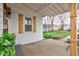 Inviting back porch area with plants, wooden features, and serene outdoor views at 805 N Tuxedo St, Indianapolis, IN 46201