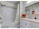 Bright bathroom features a shower-tub combo, and bright marble countertops at 805 N Tuxedo St, Indianapolis, IN 46201