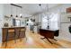 Modern kitchen with white cabinets, pendant lighting, and stainless steel appliances at 805 N Tuxedo St, Indianapolis, IN 46201
