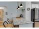 Kitchen bar seating with a view of appliances and plenty of light at 805 N Tuxedo St, Indianapolis, IN 46201
