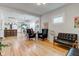 Open-concept living room with hardwood floors and seamless flow to the kitchen at 805 N Tuxedo St, Indianapolis, IN 46201