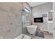 Modern bathroom featuring marble-look tile, a glass-enclosed shower, and a luxurious soaking tub at 8146 W 875 S, Pendleton, IN 46064