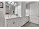 Bathroom with white cabinets, granite counters, and a double sink at 8146 W 875 S, Pendleton, IN 46064