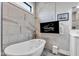 Elegant bathroom boasts a soaking tub, mounted television, and upscale finishes for ultimate relaxation at 8146 W 875 S, Pendleton, IN 46064