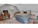 A cozy bedroom featuring a comfortable bed, an area rug, a workspace and natural lighting from the window at 8146 W 875 S, Pendleton, IN 46064