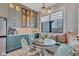 Bright breakfast nook with custom bench seating, decorative pillows, and natural light at 8146 W 875 S, Pendleton, IN 46064