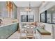 Breakfast nook featuring a built-in bench, round table, and designer lighting at 8146 W 875 S, Pendleton, IN 46064