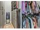 A well-organized walk-in closet with custom shelving, drawers, and hanging rods for clothes and accessories at 8146 W 875 S, Pendleton, IN 46064