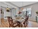 Open dining room showcasing seamless transition to the entryway, featuring beautiful décor and natural light at 8146 W 875 S, Pendleton, IN 46064